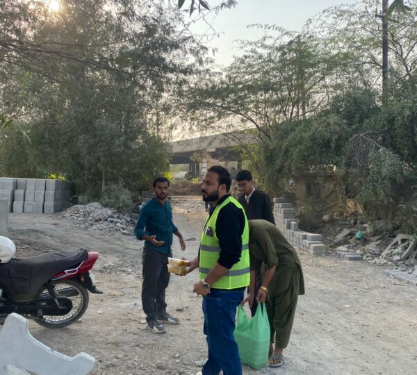 Volunteers giving meals and support packages to families facing food insecurity