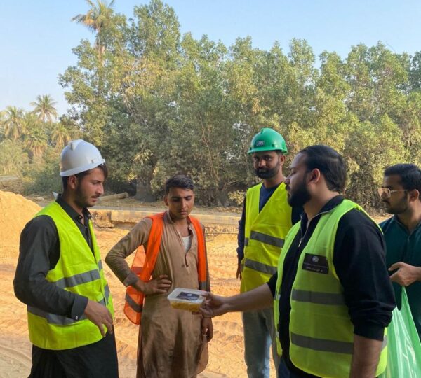 Team members and volunteers providing essential food aid to underprivileged communities