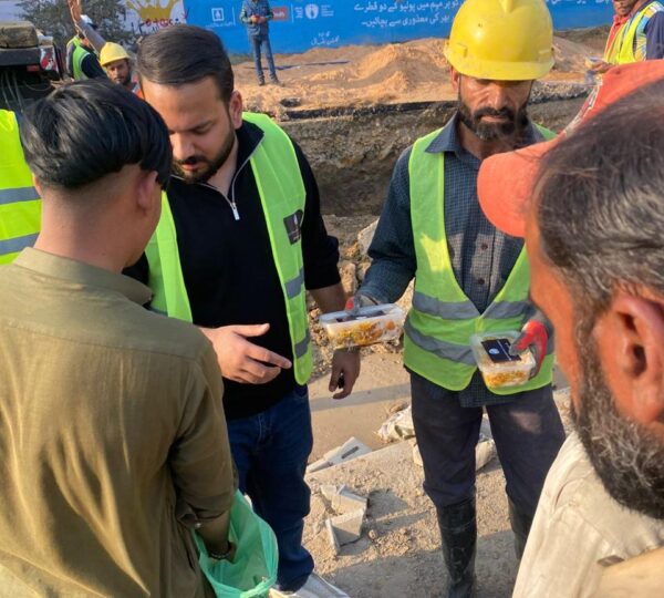 Volunteers delivering essential food and support to families in underserved areas